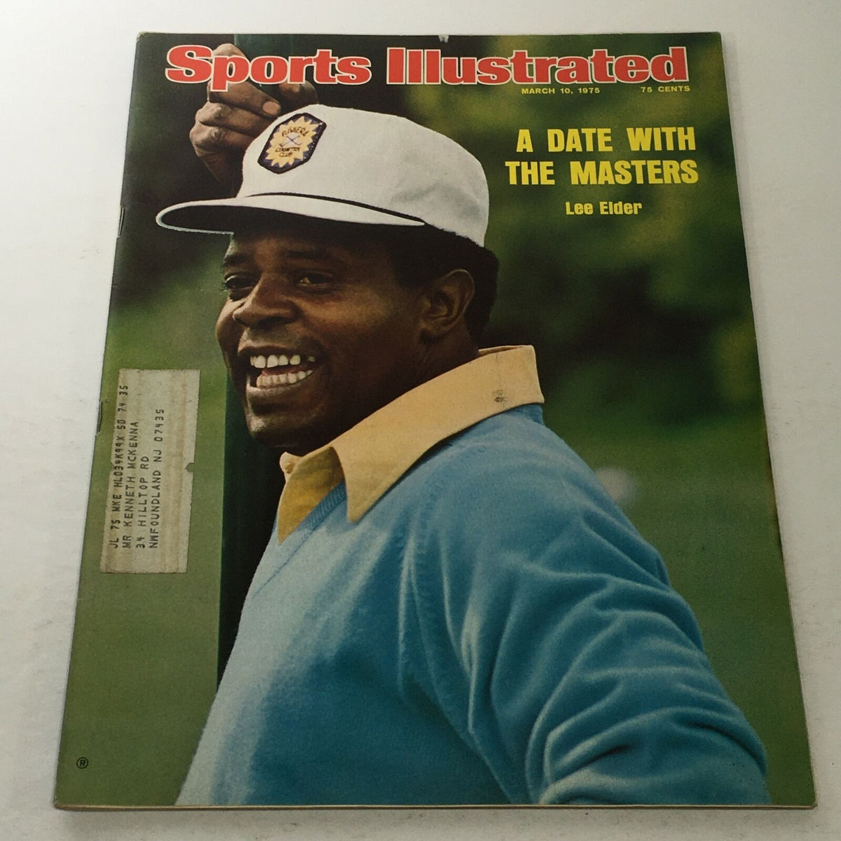 Cover of Sports Illustrated magazine from March 10, 1975, featuring Lee Elder with a cheerful expression, wearing a white cap and a blue shirt, titled 'A Date With The Masters'.