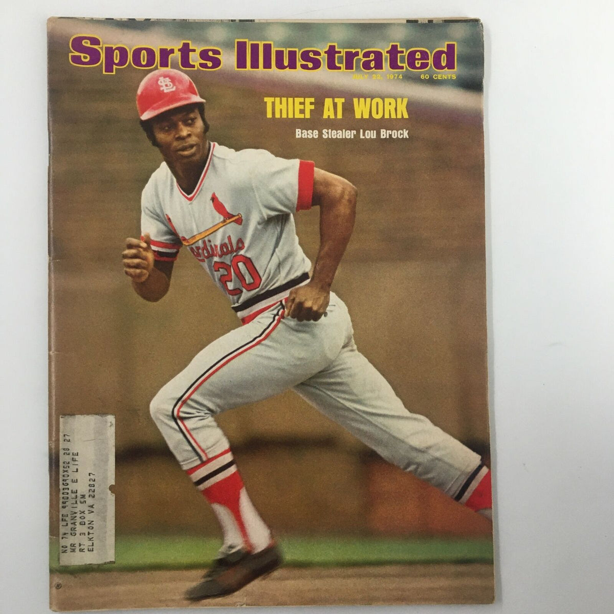 Vintage Sports Illustrated Magazine cover from July 22, 1974, featuring base stealer Lou Brock, capturing his iconic action pose in a St. Louis Cardinals uniform with the headline 'Thief at Work'.