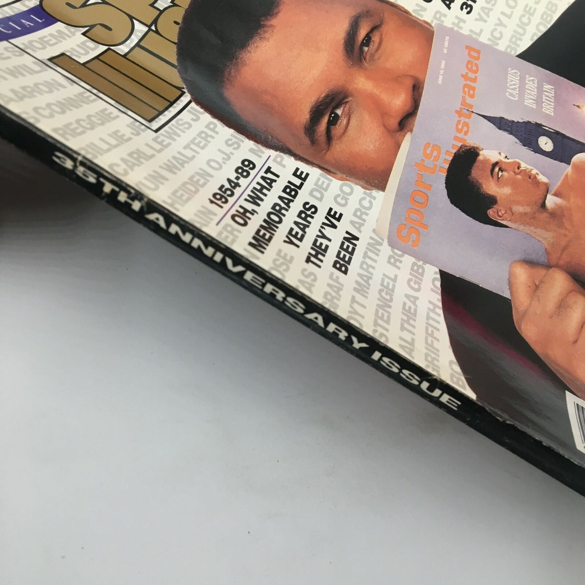 Vintage Sports Illustrated magazine cover from November 15, 1989 featuring Muhammad Ali, highlighting his legacy as 'The Champ.' The cover shows a close-up of Ali posing with the magazine.