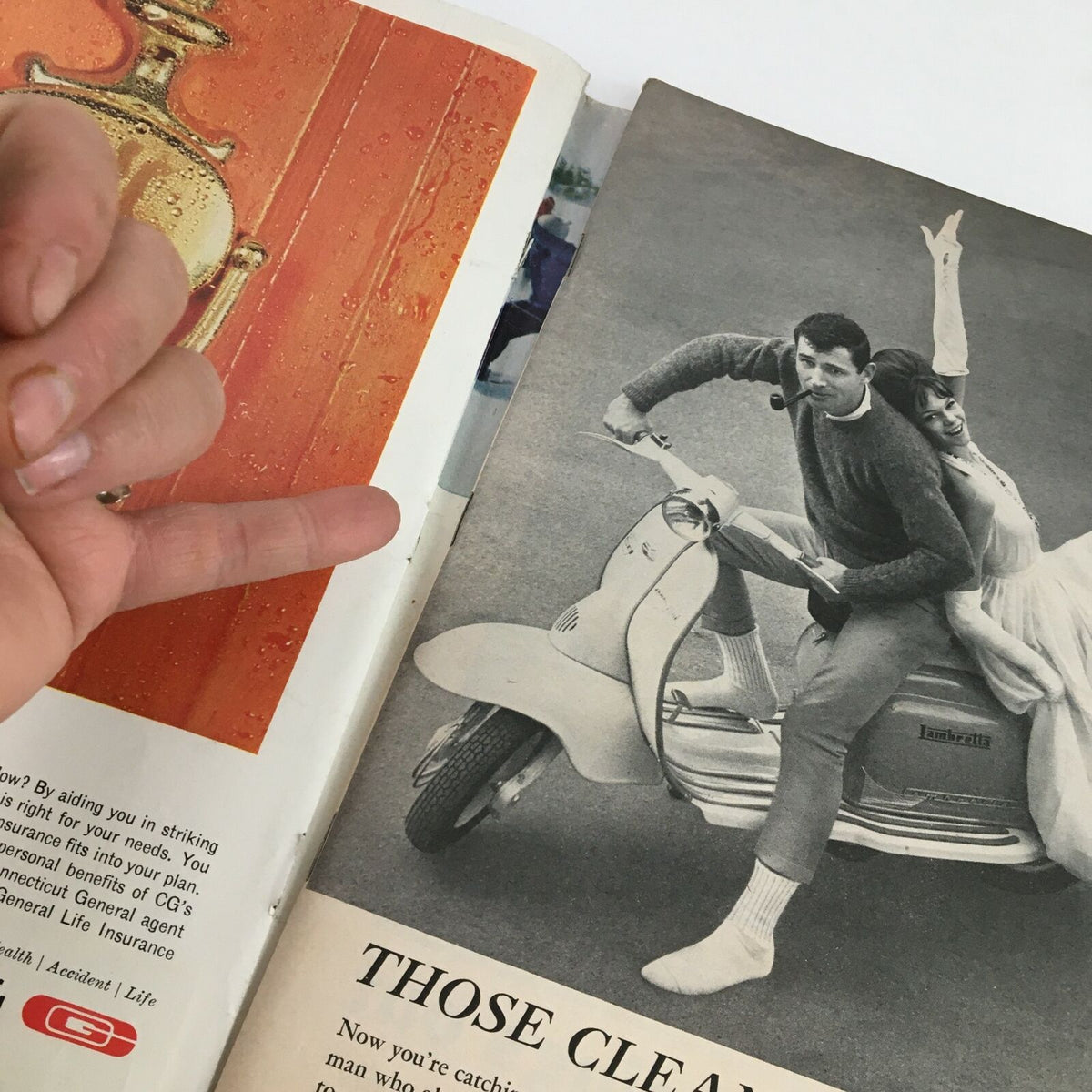 Inside spread of Sports Illustrated Magazine November 25, 1963, showing a vintage advertisement with a couple on a scooter, capturing the era's fashion and lifestyle.