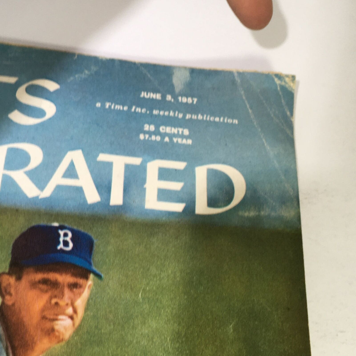 Close-up of the cover of the Vintage Sports Illustrated Magazine from June 3, 1957, highlighting the title and price details.