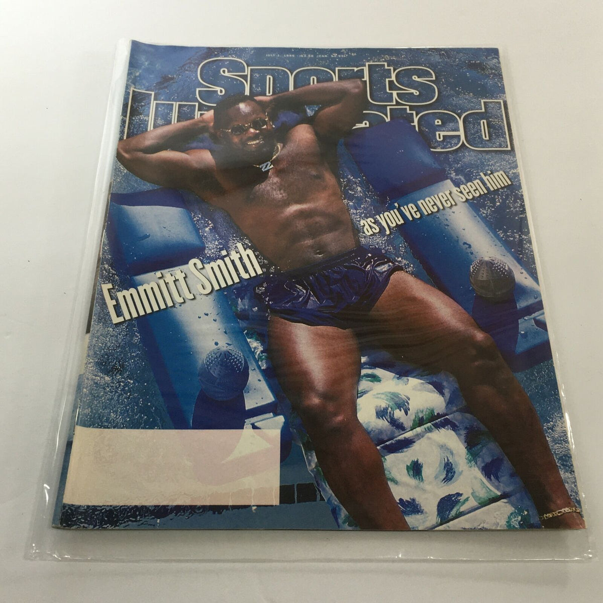 Cover of Sports Illustrated magazine dated July 1, 1996, featuring Emmitt Smith in swimwear, with the headline 'Emmitt Smith as you've never seen him'. The magazine is displayed in a protective plastic covering.
