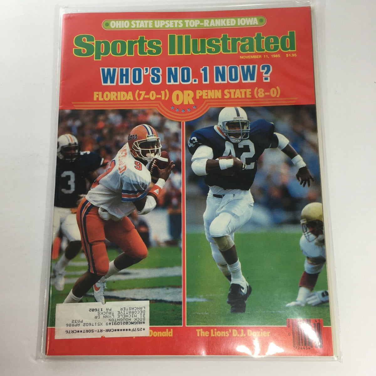 Sports Illustrated cover from November 11, 1985, featuring The Lion's D.J. Dozier and a comparison of Florida (7-0-1) against Penn State (8-0), showcasing college football action.