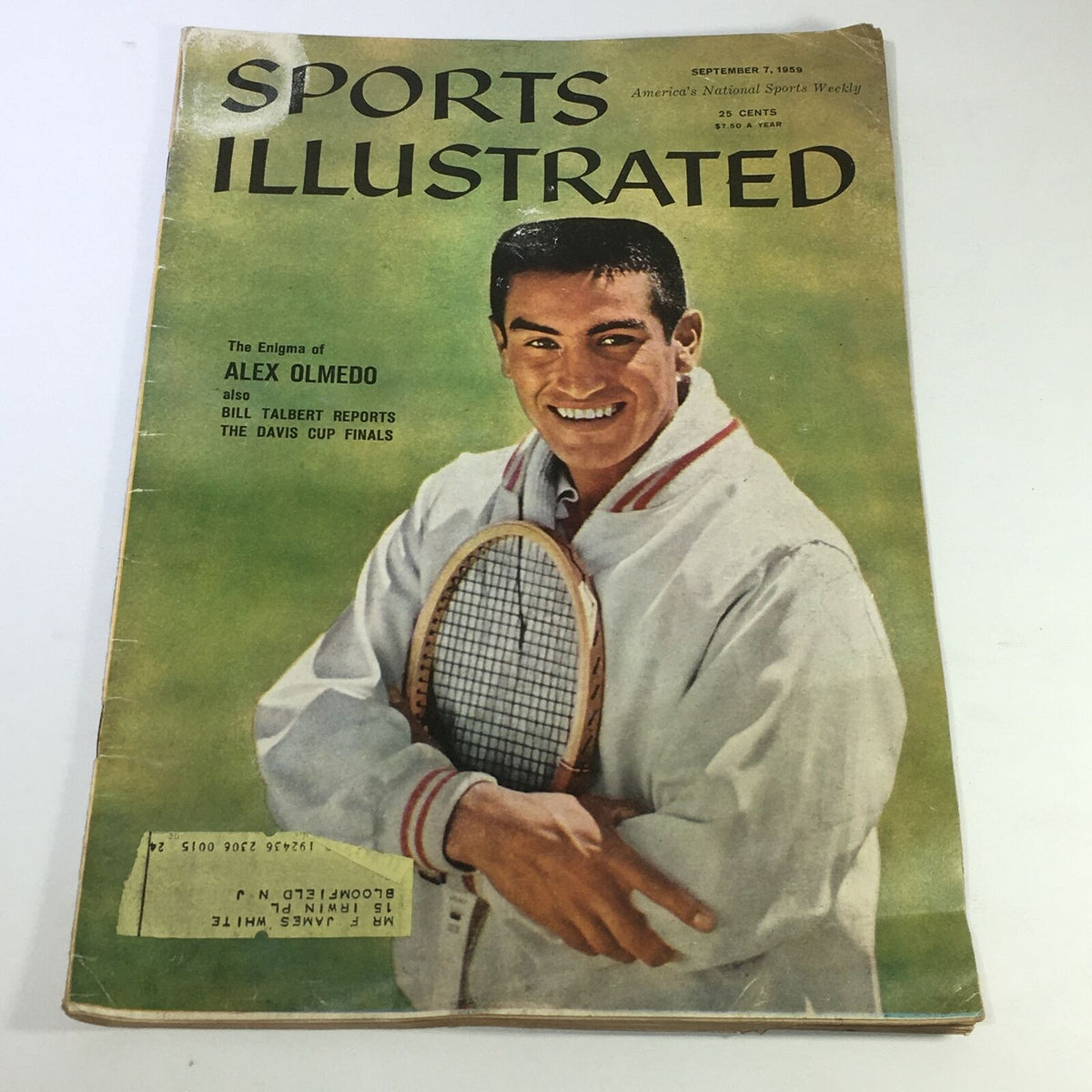 Cover of the vintage Sports Illustrated Magazine dated September 7, 1959, featuring the article 'The Enigma of Alex Olmedo' with a smiling Alex Olmedo holding a tennis racket.