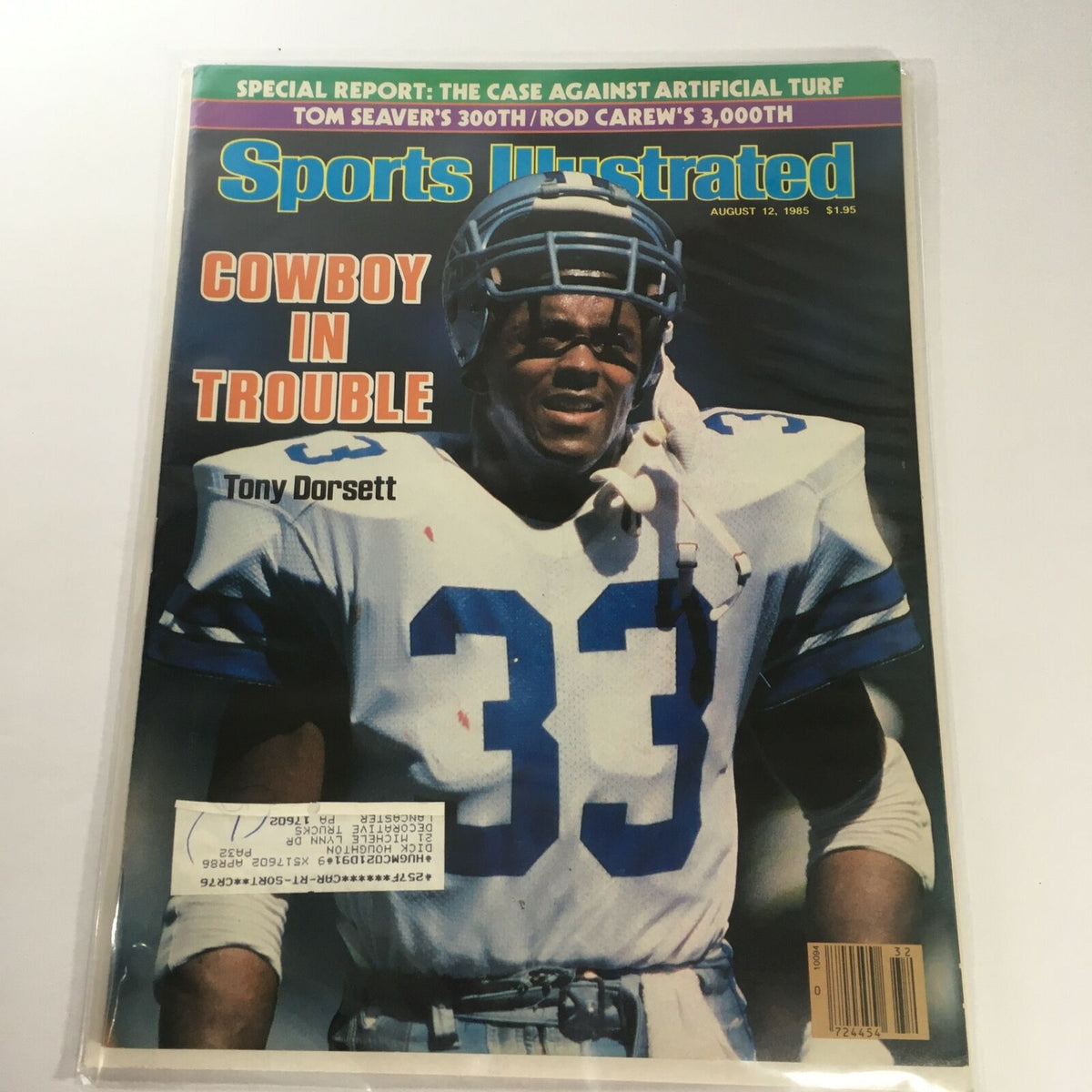 Cover of Sports Illustrated dated August 12, 1985, featuring Tony Dorsett with the headline 'Cowboy In Trouble.' The magazine illustrates Dorsett in a football uniform, emphasizing sports memorabilia.