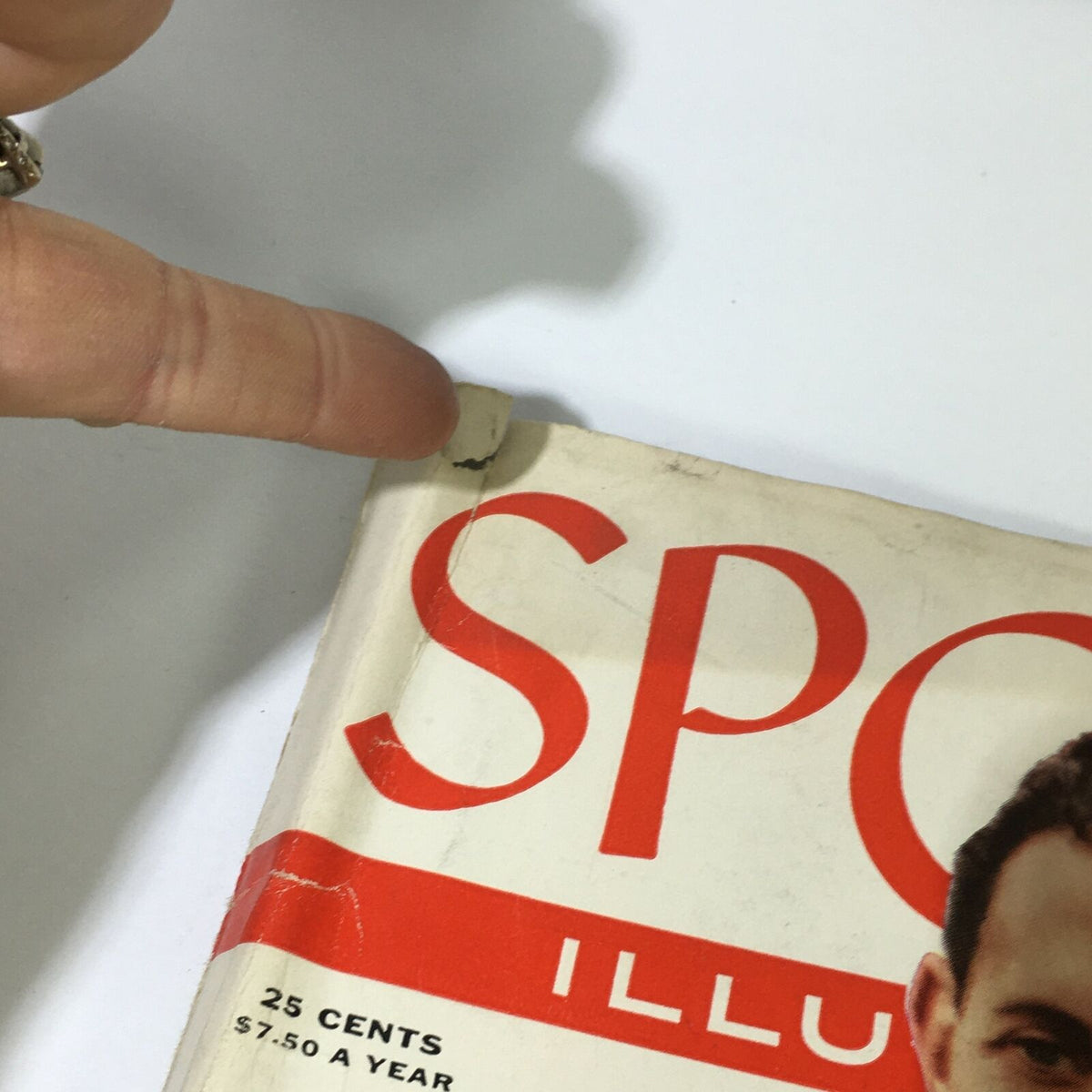 Close-up of the May 21, 1956 Sports Illustrated Magazine featuring a minor tear near the cover corner.