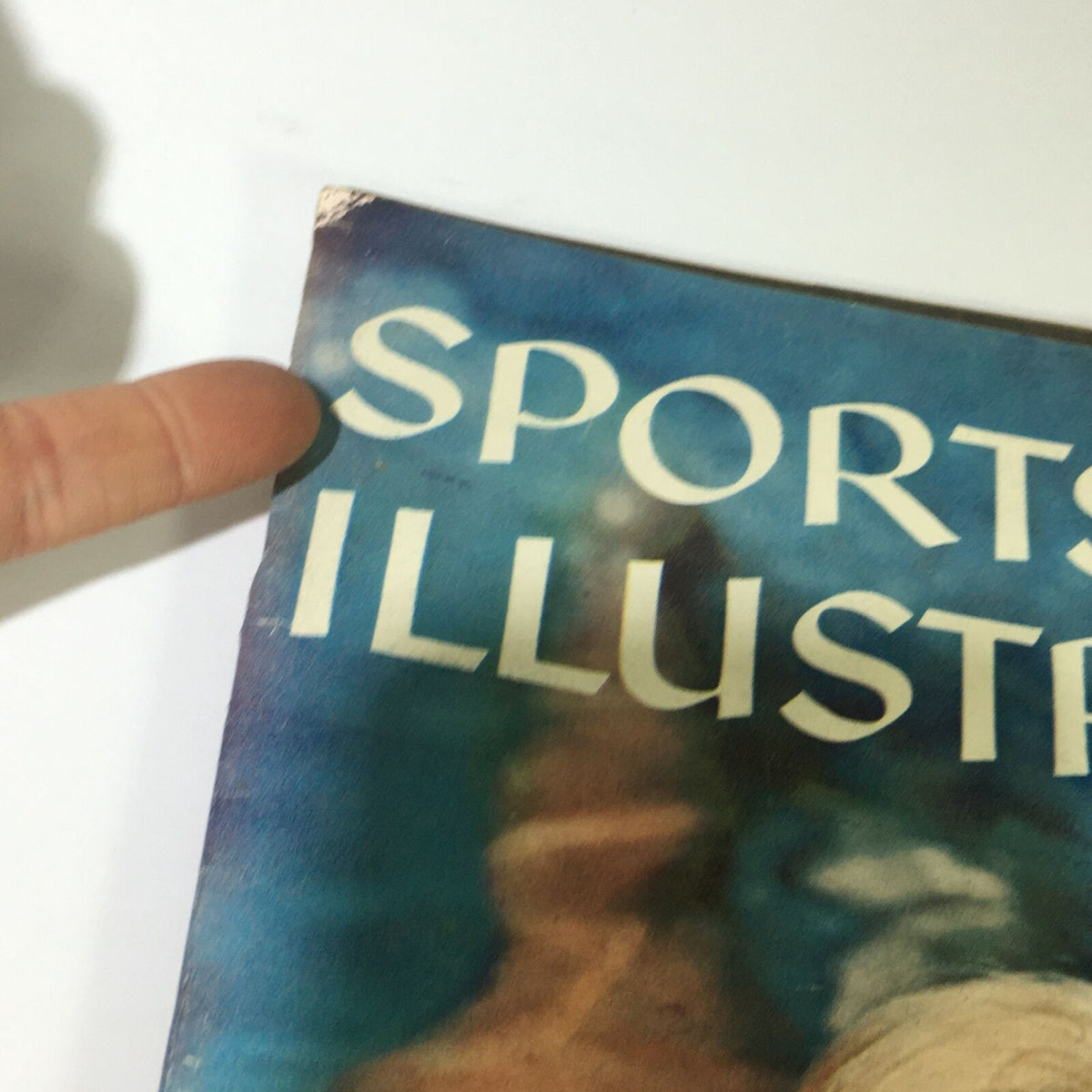 Close-up of the cover of VTG Sports Illustrated Magazine July 21, 1958, showing the title 'Sports Illustrated' and signs of age.