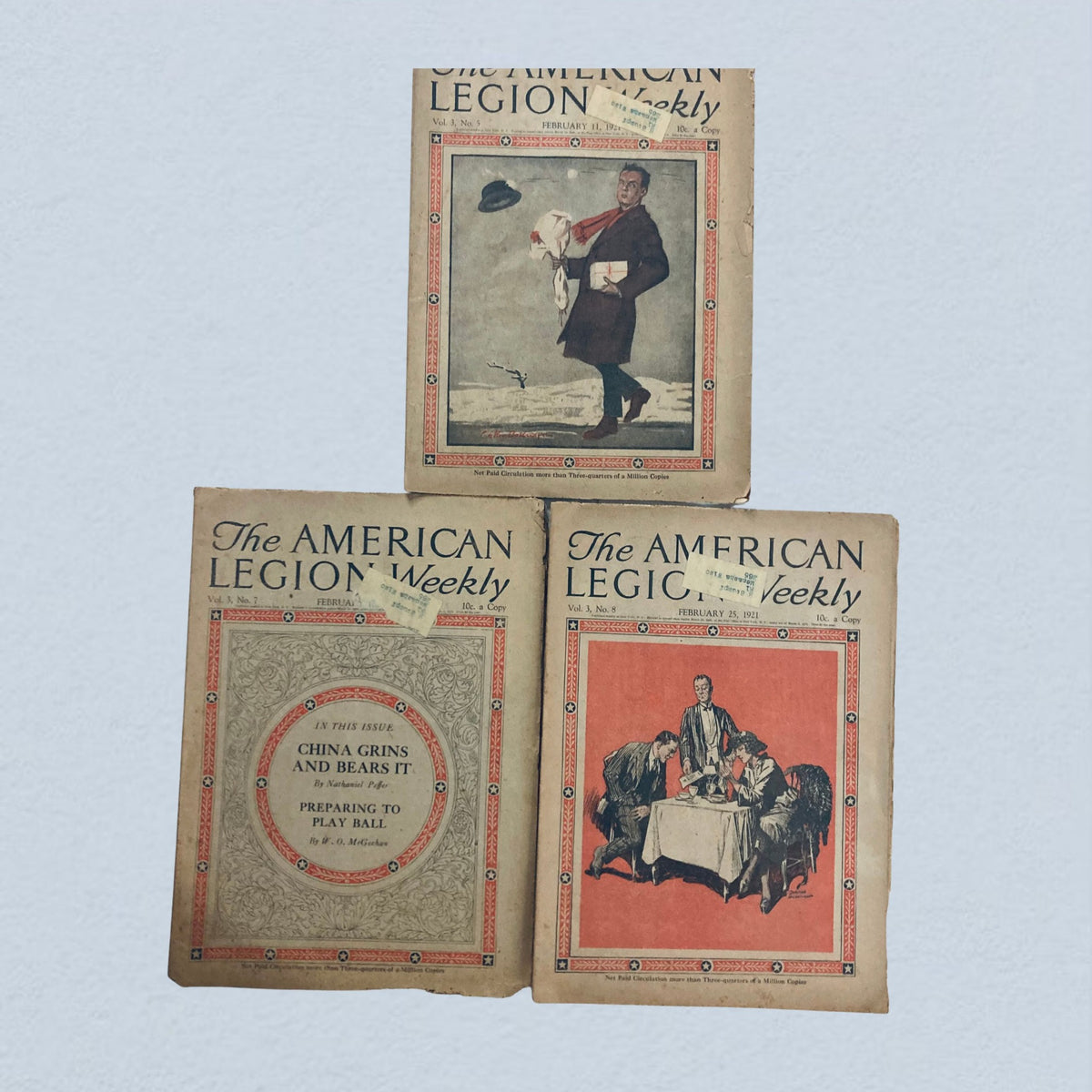 Lot of 40 VTG The American Legion Weekly Magazine January, December 1921 displaying three antique magazine covers, featuring illustrated artwork and topics relevant to post-World War I America.
