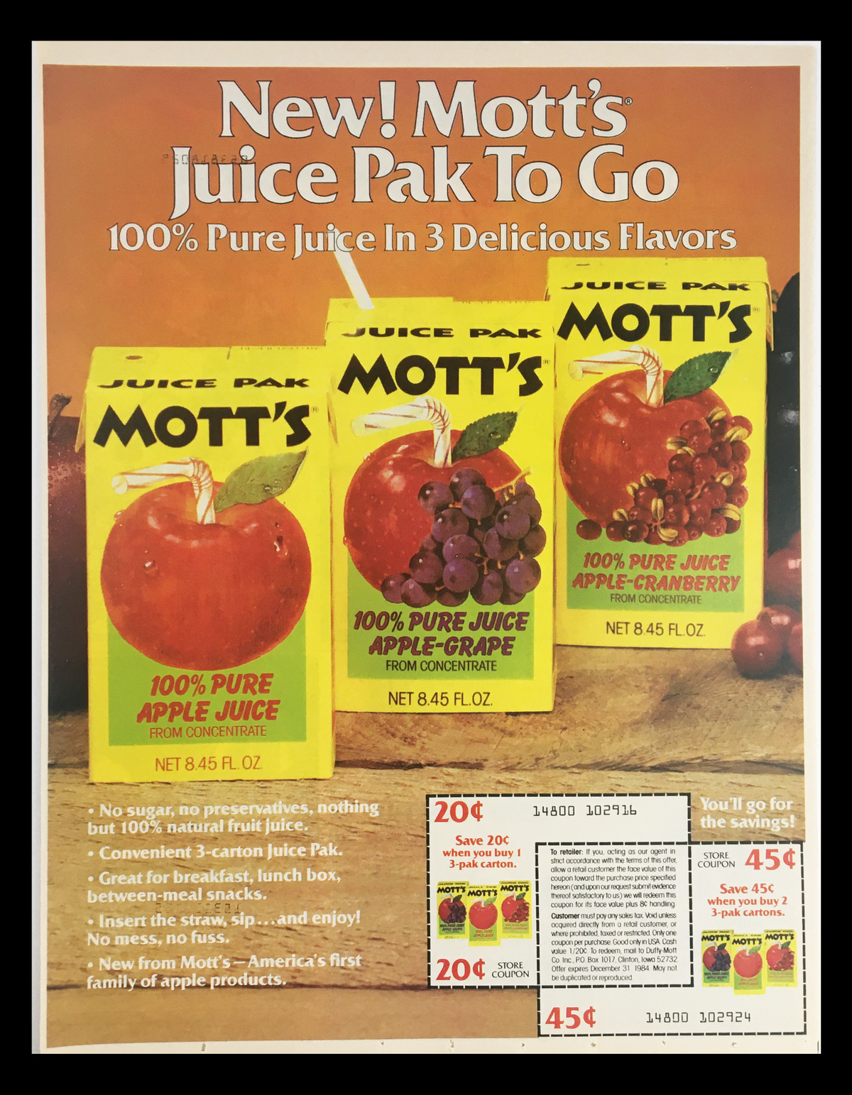 1984 Mott's Pure Juice Apple-Grape Circular Coupon Advertisement showcasing Mott's Juice Pak To Go in three flavors: Apple, Apple-Grape, and Apple-Cranberry. The advertisement highlights the natural fruit juice composition, convenience for snacks and lunch boxes, and includes promotional coupons for savings.