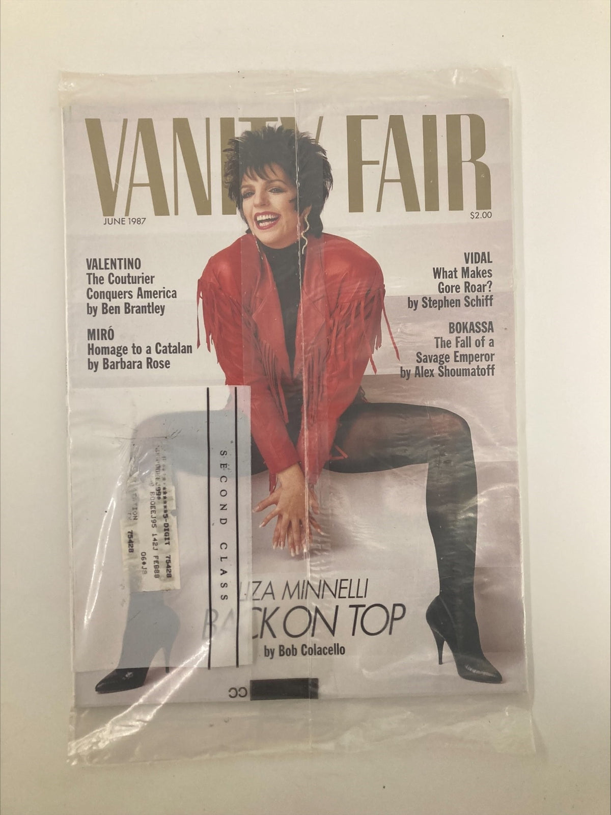 Vintage Vanity Fair Magazine from June 1987 featuring Liza Minnelli titled 'Back On Top', showcasing a vibrant cover design with Minnelli in a red jacket, highlighting a significant moment in her career.