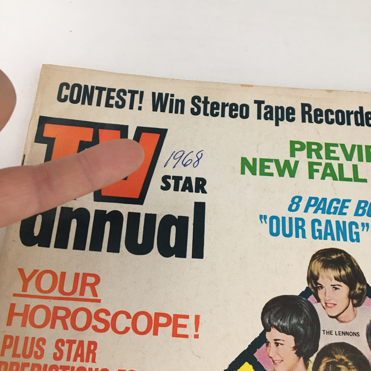 Close-up of the TV Star Annual Magazine 1968 No. 25 showing the publication year and promotional details, with a finger pointing at '1968'.