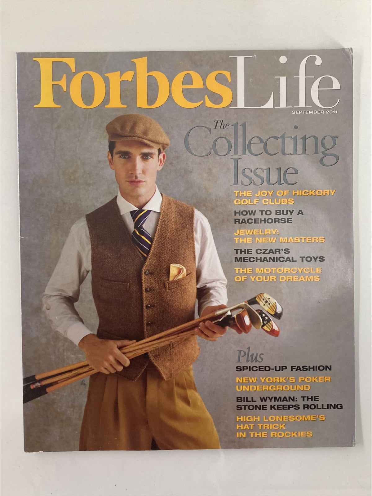 Cover of Forbes Life Magazine September 2011 featuring 'The Joy of Hickory Golf Clubs', showcasing a man in stylish vintage attire holding golf clubs.