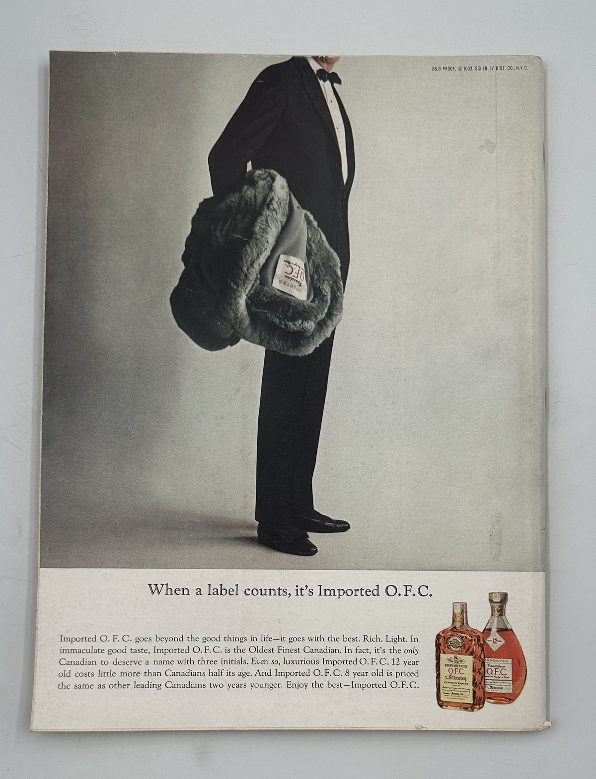 The New Yorker Magazine October 27, 1962 Stage Curtain Abe Birnbaum Cover featuring a vintage Chivas Regal whisky advertisement with a tuxedoed figure carrying a fur-covered bag and illustrated whisky bottles.