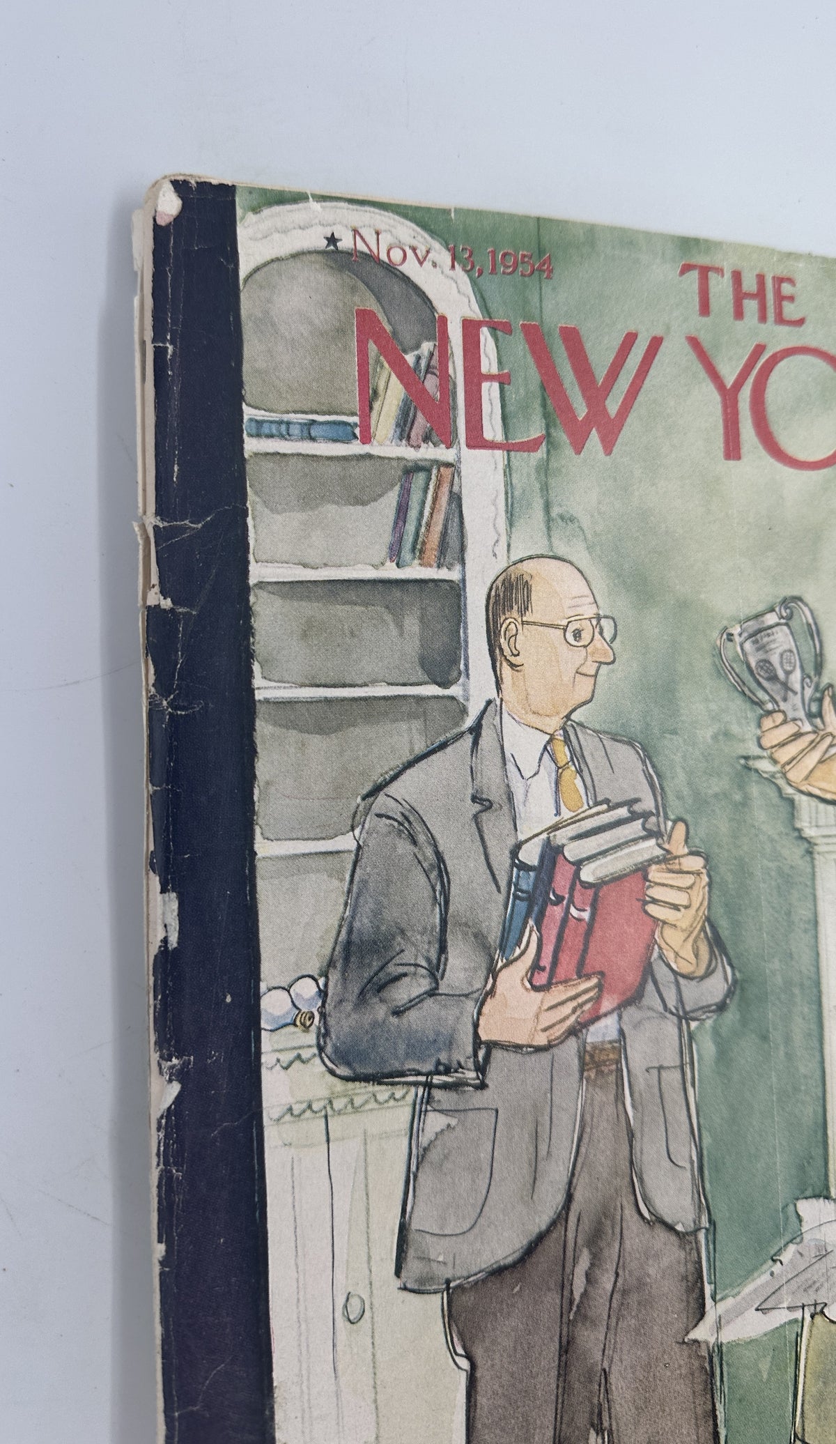 The New Yorker Magazine November 13, 1954 Moving Perry Barlow Cover, close-up view of the worn spine and left side of the illustrated vintage magazine cover.