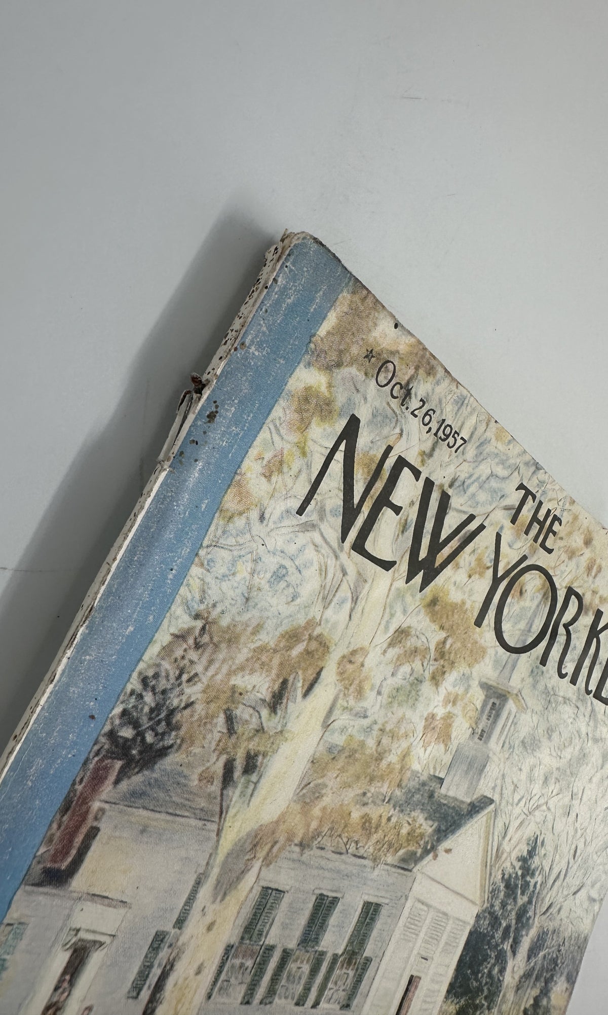 The New Yorker Magazine October 26, 1957 School Garrett Price Cover, close-up of the worn upper-left cover corner and spine.