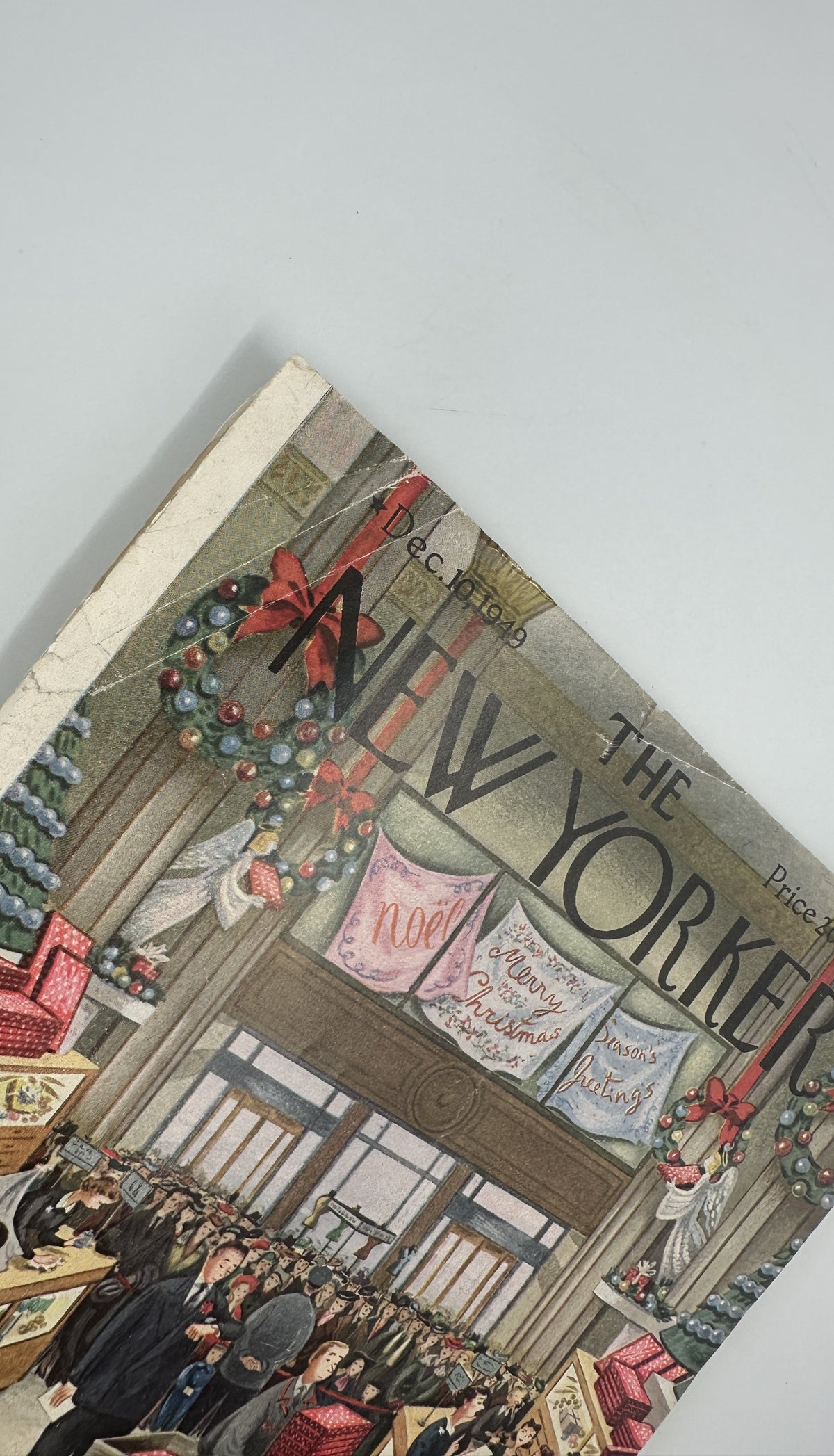 The New Yorker Magazine December 10, 1949 Christmas Store Constantin Aladjalov Cover shown at an angle with visible vintage cover wear and creasing.