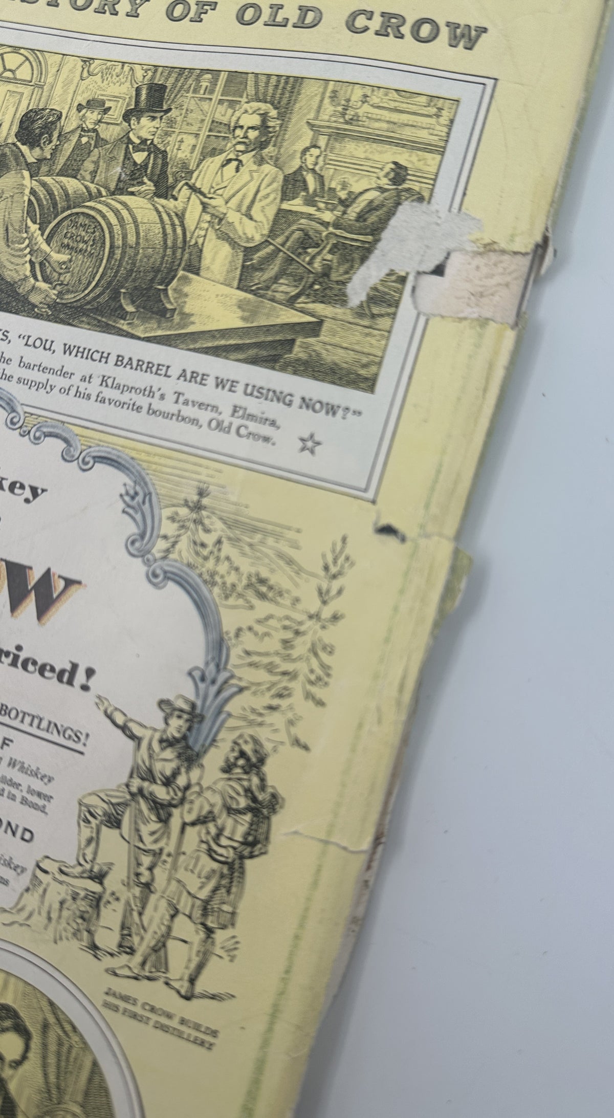 Close-up of the worn back cover edge of The New Yorker Magazine April 16, 1955 Mailbox Letter Carrier Perry Barlow Cover, showing a vintage Old Crow whiskey advertisement, creases, and edge damage.