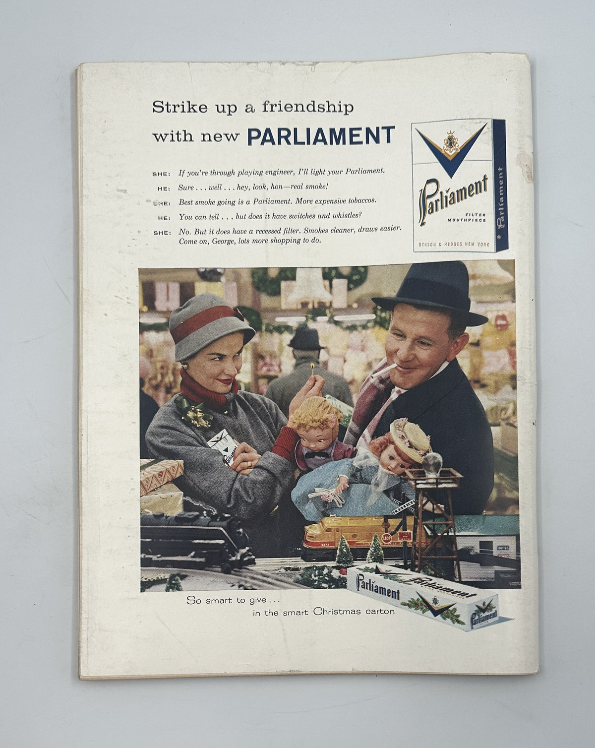 The New Yorker Magazine December 14, 1957 Family Christmas Tree Edna Eicke Cover shown with a vintage Parliament cigarette advertisement featuring a fashionable couple