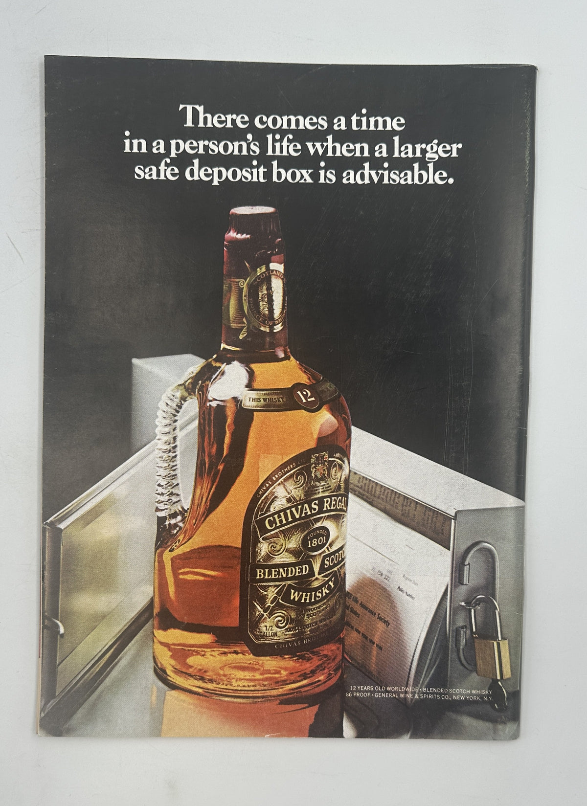 The New Yorker Magazine April 7, 1975 Plus Minus Cloud Saul Steinberg Cover VG, showing a vintage Chivas Regal whisky advertisement with a bottle beside a safe deposit box.