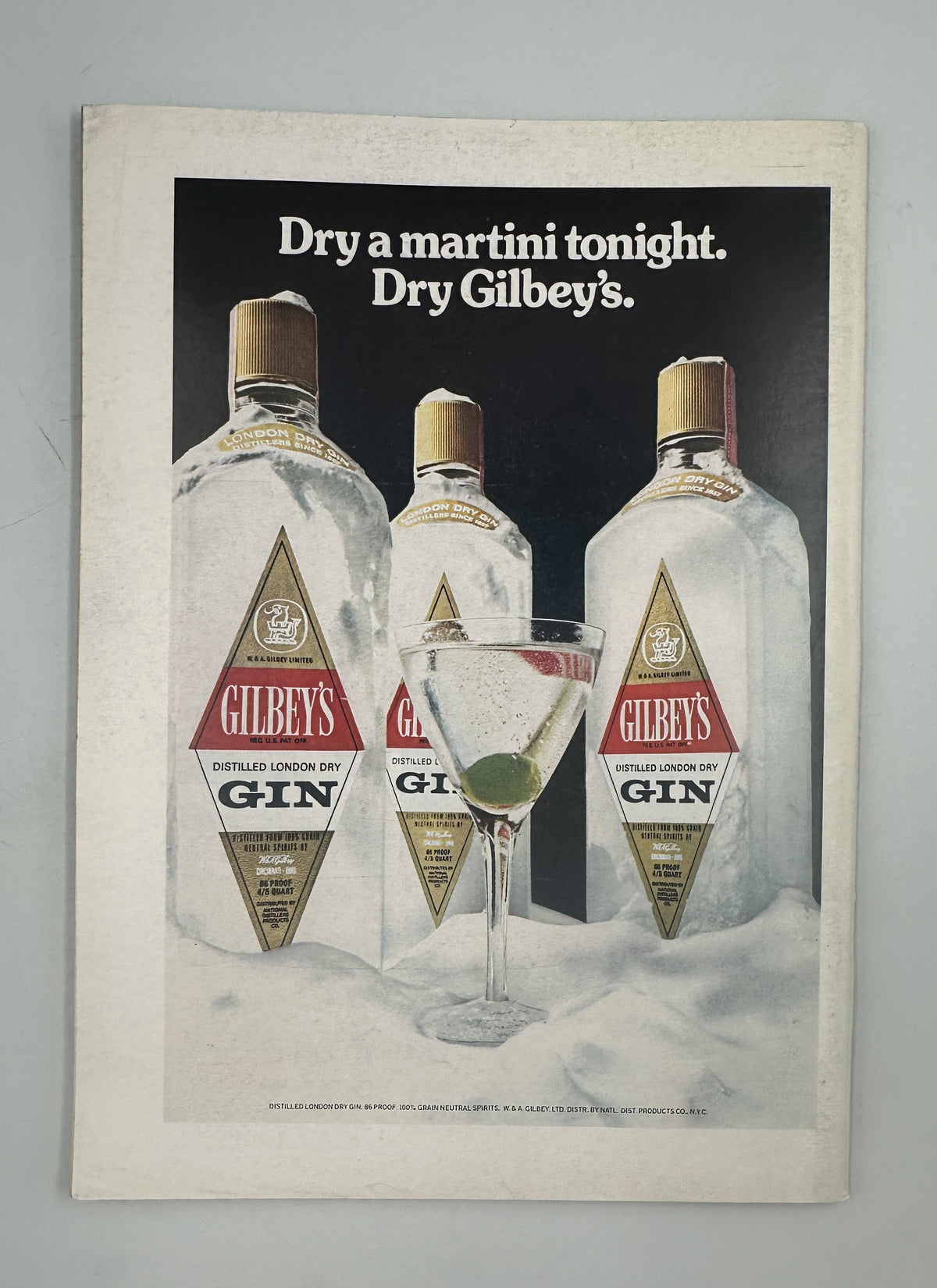 The New Yorker Magazine October 6, 1975 Stage TV Rocking Chair Eugène Mihaesco Cover VG, featuring a vintage Gilbey's Gin advertisement with three gin bottles and a martini glass in a snowy scene.