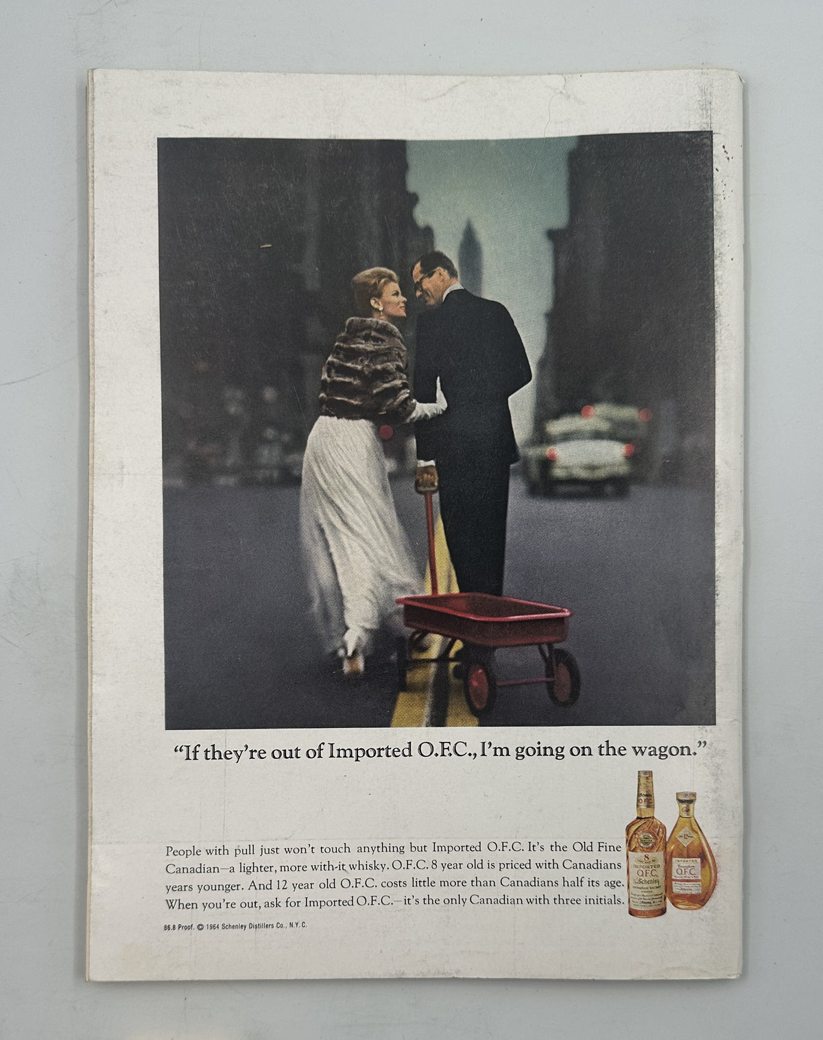 The New Yorker Magazine September 26, 1964 Apple Pear Orange Fruit Abe Birnbaum Cover, shown open to a vintage illustrated advertisement featuring a couple with a red wagon and liquor bottles.