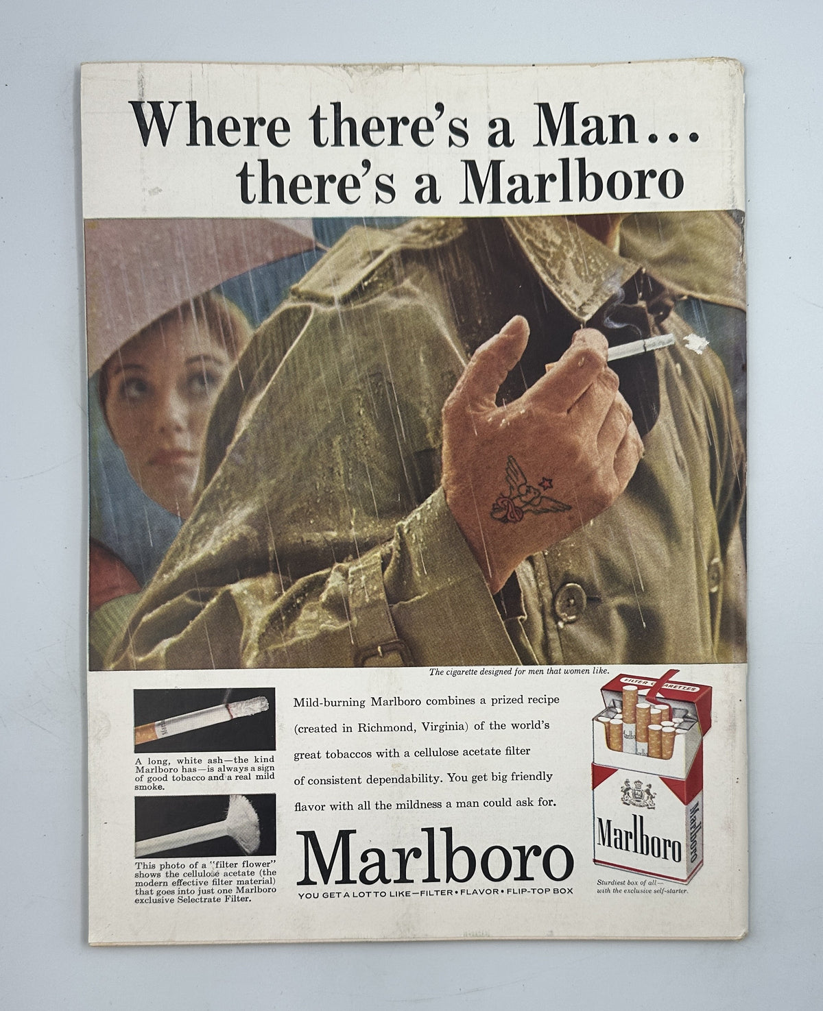 The New Yorker Magazine March 29, 1958 Art Gallery Constantin Aladjalov Cover featuring a vintage Marlboro cigarette advertisement with a couple in rainwear, cigarette pack, and slogan "Where there's a Man... there's a Marlboro."