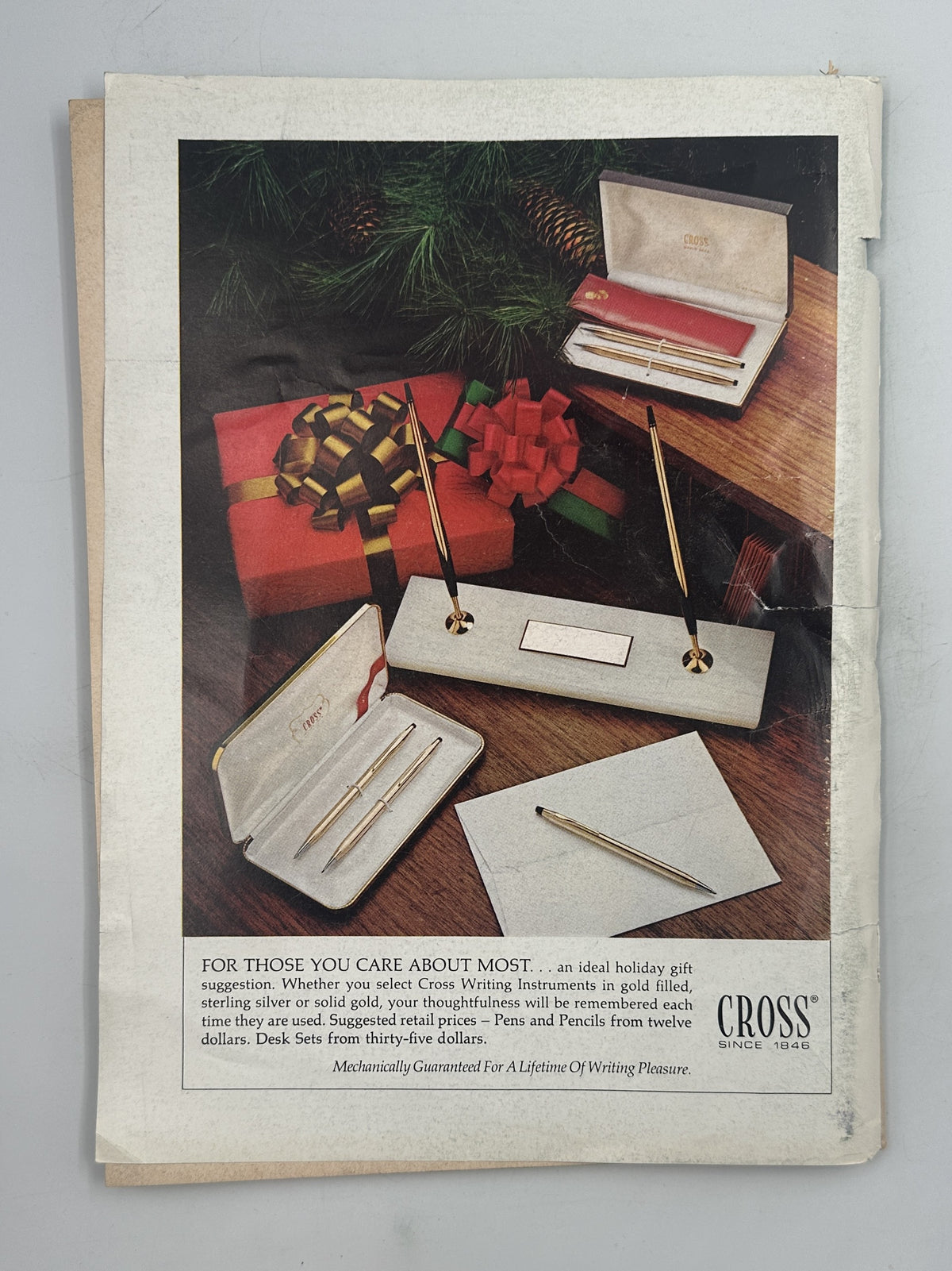 The New Yorker Magazine November 24, 1975 Movie Theater Lobby Charles Saxon Cover, showing a vintage Cross writing instrument advertisement with gifts, stationery, and a desk set.