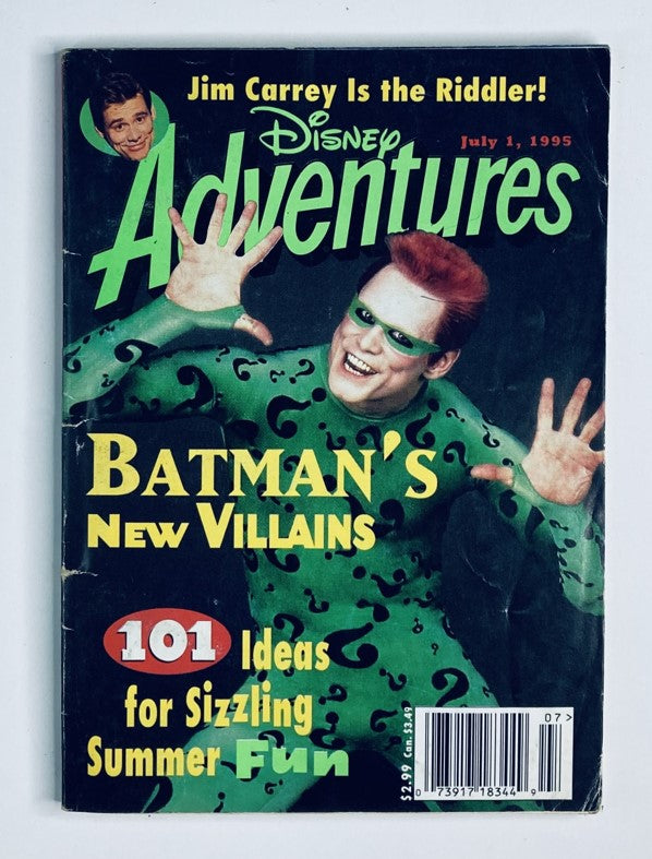 Disney Adventures Magazine cover featuring Jim Carrey as the Riddler, July 1, 1995. The cover showcases vibrant colors and highlights 'Batman's New Villains' along with '101 Ideas for Sizzling Summer Fun.' A nostalgic collectible for fans of Disney and superhero culture.