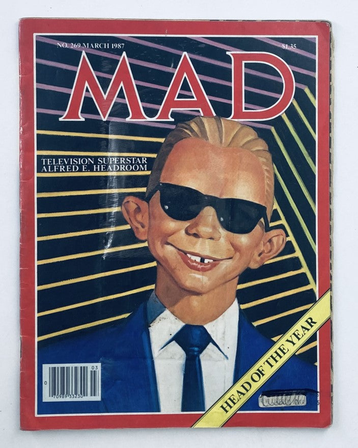 Mad Magazine March 1987 No. 269 featuring TV Superstar Alfred E. Headroom on the cover, highlighting its vintage appeal. The magazine is rated 4.0 VG (Very Good) condition, showcasing classic humor from the '80s.