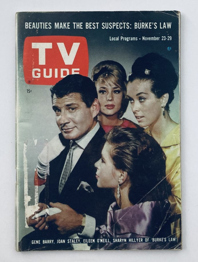 Cover of TV Guide Magazine November 23, 1963, Issue #556 featuring Gene Barry and Joan Staley along with Eileen O'Neill and Sharyn Hillyer, promoting the television show Burke's Law.