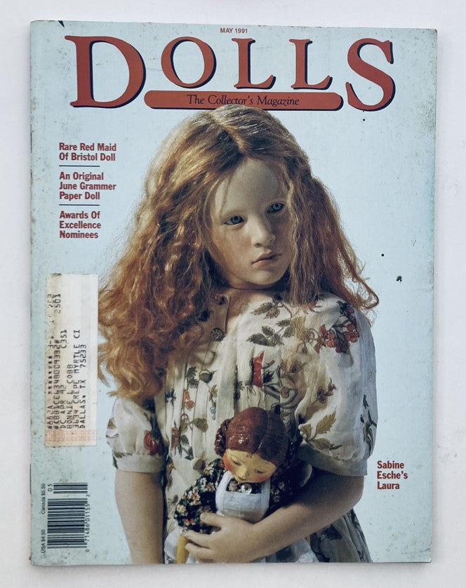 Cover of VTG Dolls The Collector's Magazine May 1991 Volume 10 Number 3 featuring Sabine Esche's Laura, showcasing a girl with long hair holding a doll, highlighting vintage doll collecting and artistry.