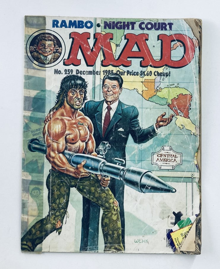 Cover of Mad Magazine December 1985 No. 259 featuring Sylvester and Ronald Reagan, showcasing satirical illustrations, with a humorous depiction of Rambo and Reagan, highlighting political satire from the mid-1980s.