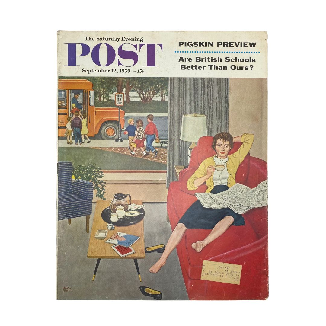 Cover of the Saturday Evening Post Magazine dated September 12, 1959, featuring a heartwarming illustration by Amos Sewell. The cover depicts a cozy living room scene with a woman reading a newspaper in a red chair, while children play outside near a school bus. Perfect for collectors of vintage magazines and Americana.