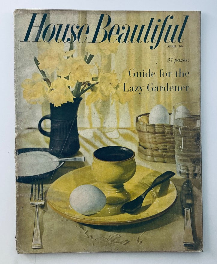 House Beautiful Magazine April 1958 cover featuring a still life arrangement including flowers, a yellow plate with an egg, cutlery, and a basket, highlighting interior design themes and gardening tips.