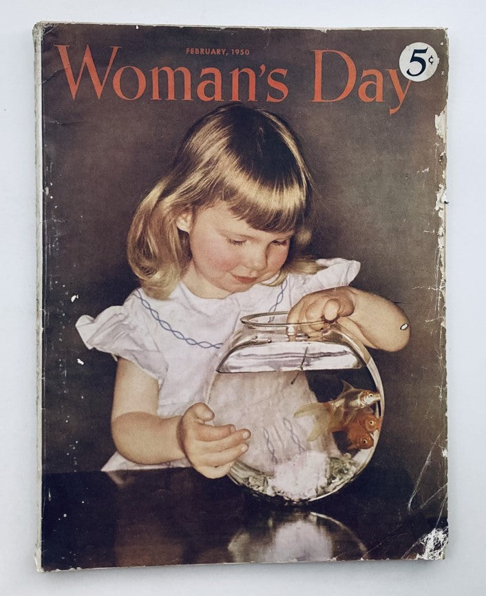 Cover of VTG Woman's Day Magazine February 1950 featuring a young girl interacting with a fishbowl, showcasing nostalgia and charm in vintage publishing.