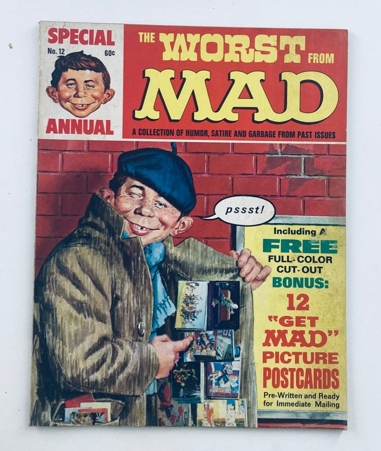 Cover of Mad Magazine 1969 12th Annual Edition: The Worst From Mad, featuring a humorous illustration of a boy holding postcards and wearing a coat, with the headline emphasizing the satirical collection.
