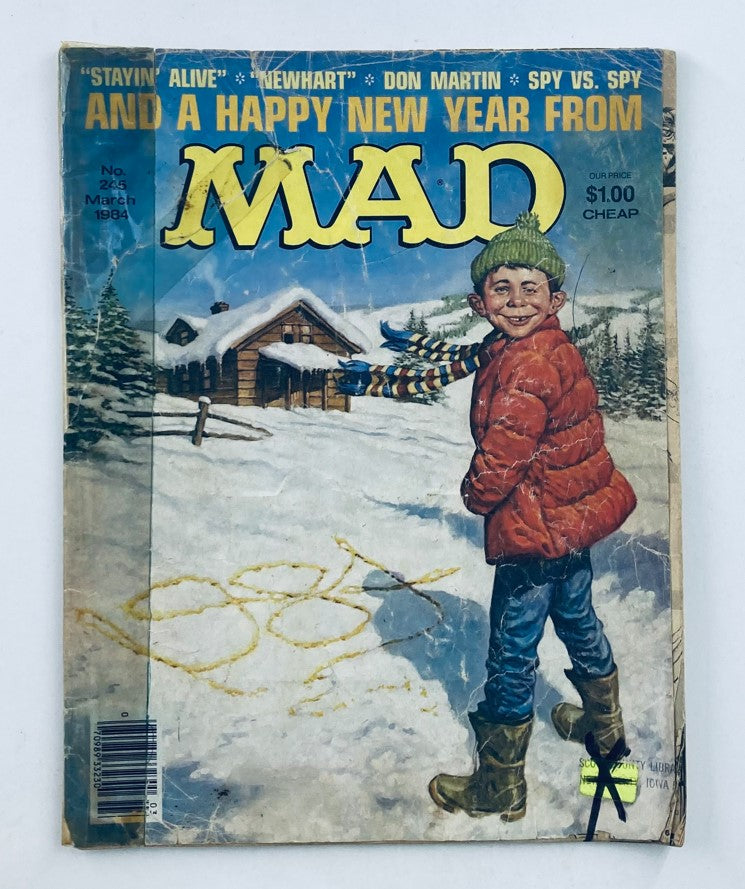 Mad Magazine March 1984 No. 265 cover featuring a boy in a red jacket celebrating winter with snowy scenery and the iconic 'Stayin Alive' title.