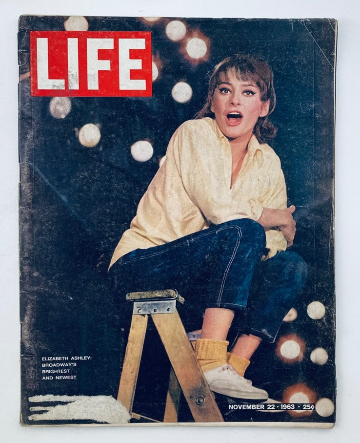 Cover of Life Magazine November 22 1963 Vol 55 No. 21 featuring Broadway star Elizabeth Ashley sitting on a stool, showcasing a vintage style with soft focus lights in the background.