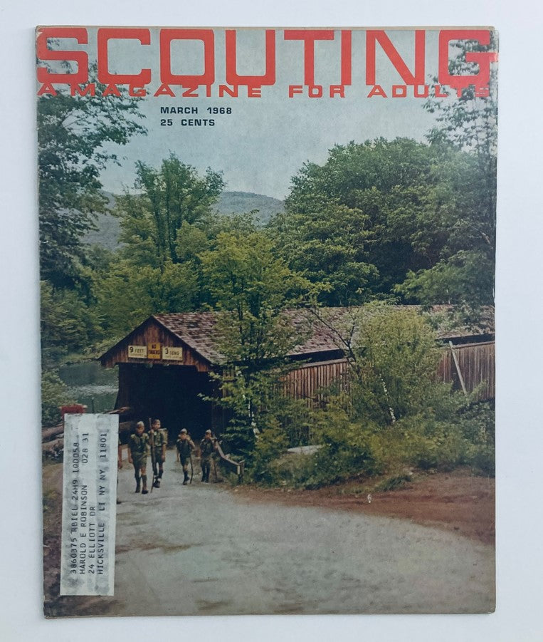Cover of VTG Scouting Magazine March 1968, Volume 56, No. 3 featuring a scenic image of a troop advancing toward a wooden structure, showcasing vibrant nature and capturing the essence of scouting.