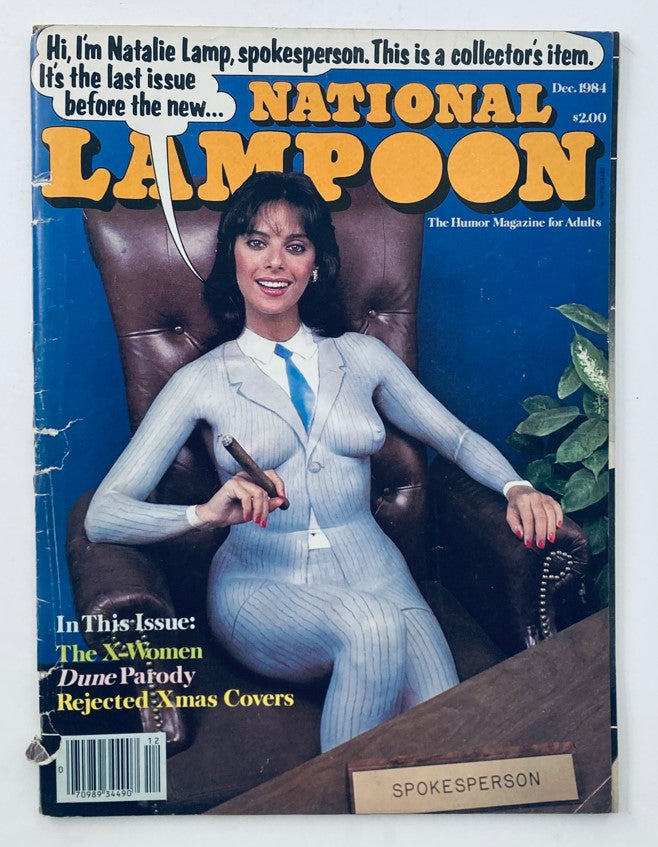 National Lampoon Magazine from December 1984 featuring the X-Women Parody, showcasing a stylishly dressed spokesperson on the cover. This vintage magazine is recognized as a collector's item, highlighting the humor and satire characteristic of National Lampoon, perfect for enthusiasts of pop culture and comedy.
