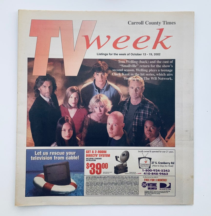 TV Week Magazine cover from October 13, 2002, featuring Tom Welling and the cast of Smallville, showcasing a vintage television guide listing for the week.
