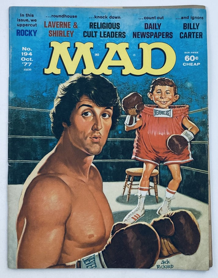 Mad Magazine October 1977 No. 194 featuring Sylvester Stallone as Rocky Balboa, showcasing a humorous cover art with Stallone in a boxing pose and a cartoon character beside him.