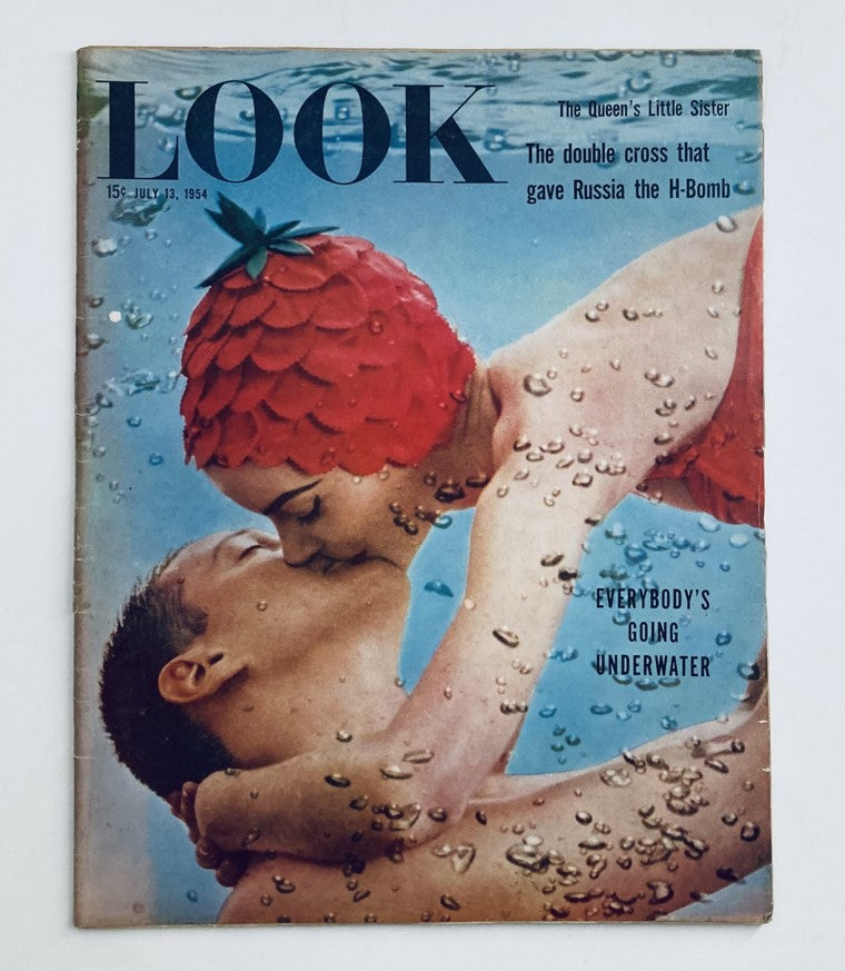Cover of VTG Look Magazine July 13, 1954, featuring a striking image of a couple underwater with a woman in a vibrant strawberry-themed costume, emphasizing the magazine's mid-century aesthetics.