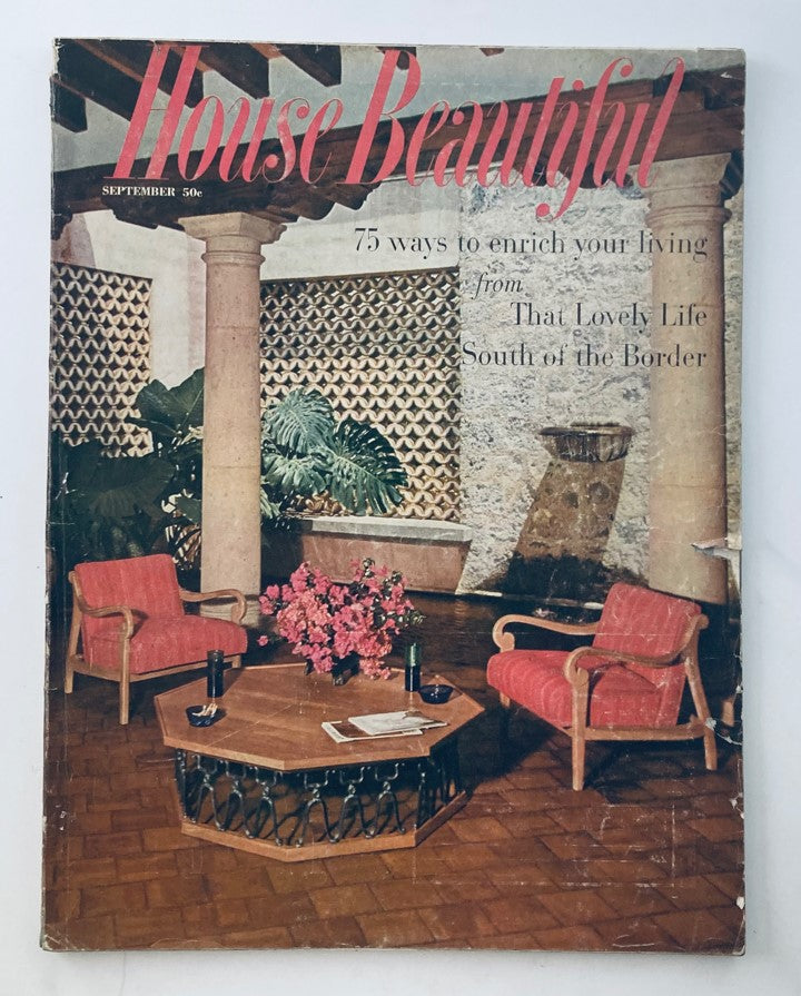 House Beautiful Magazine September 1957 cover featuring a charming interior scene with red upholstered chairs, a wooden coffee table, and vibrant floral decorations, highlighting mid-century design and decor.