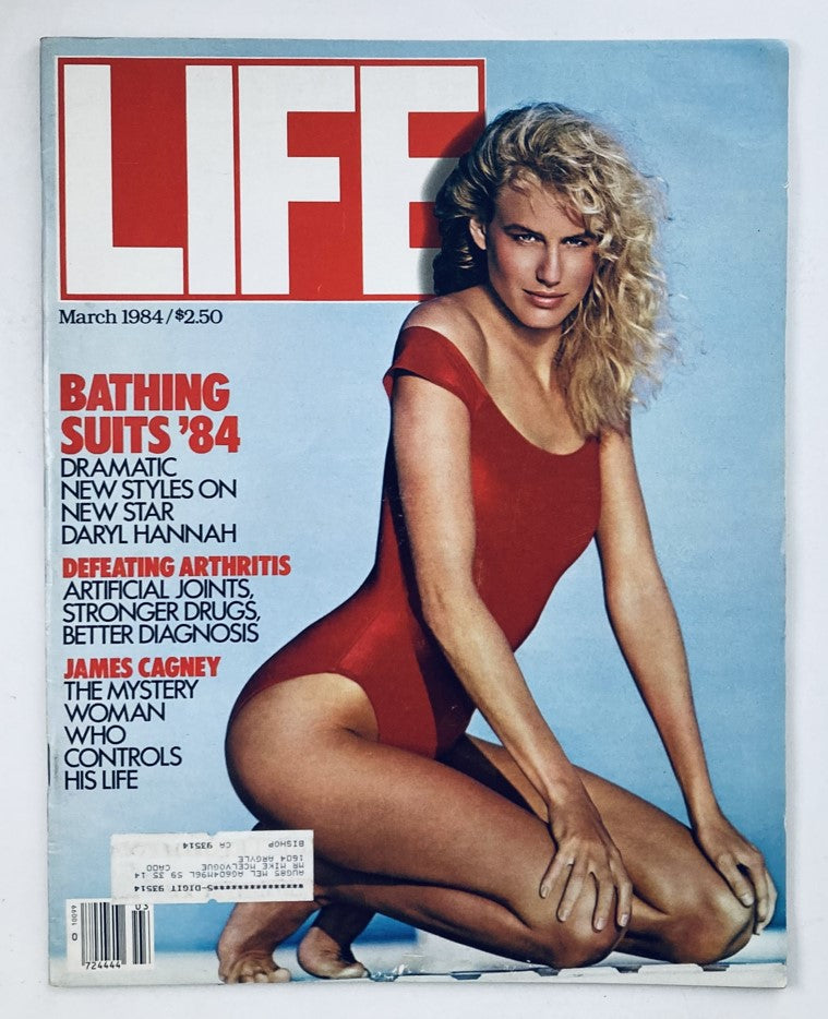 Vintage Life Magazine March 1984 featuring film actress Daryl Hannah on the cover in a red swimsuit, showcasing her iconic beauty and style.