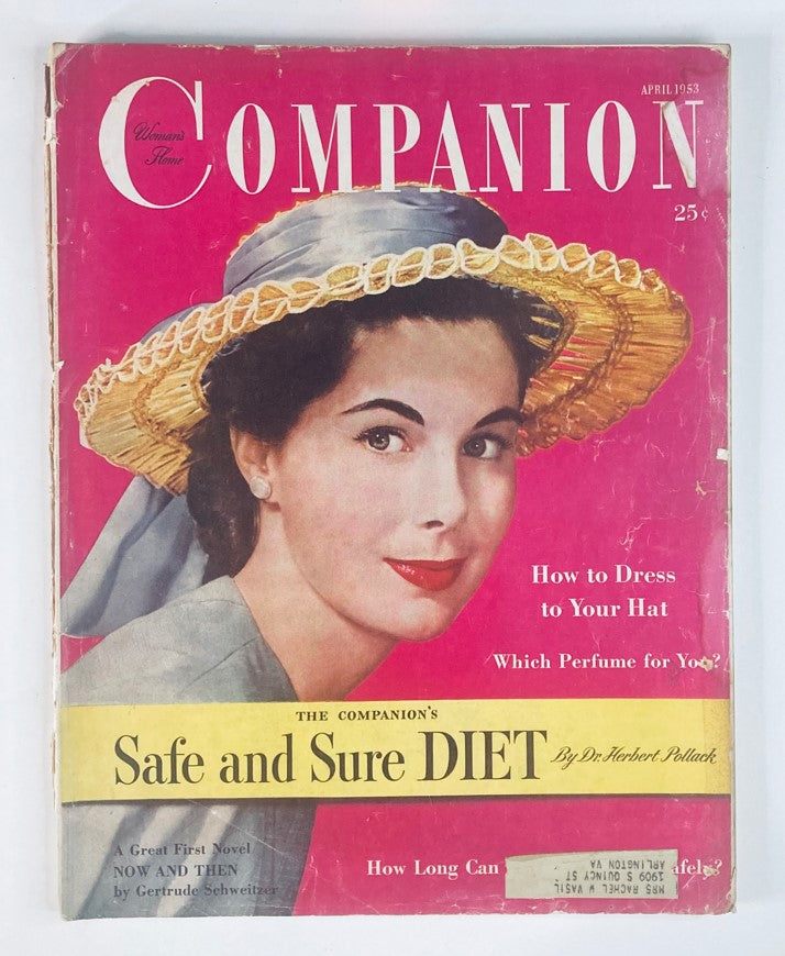 Cover of VTG Woman's Home Companion Magazine April 1953 featuring the article 'How To Dress Your Hat,' showcasing a fashionable woman wearing a decorative hat with a pink background.