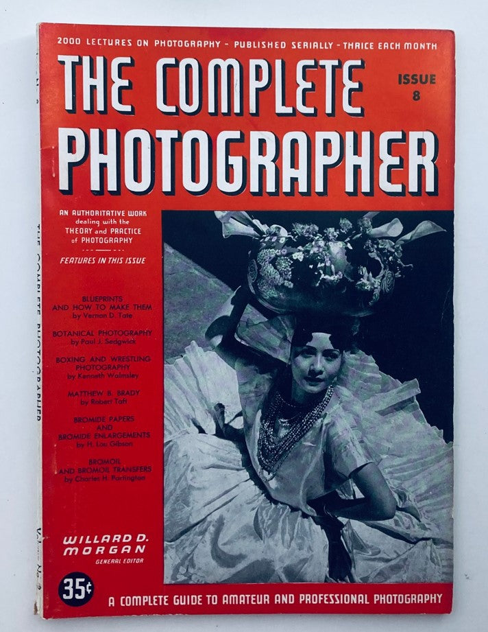 The Complete Photographer Magazine cover from November 30, 1941, featuring issue 8 with a striking red background and images, including a woman in traditional attire and articles on photography techniques.