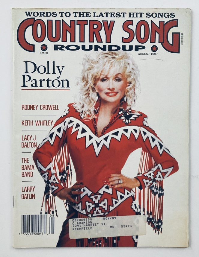 Vintage Country Song Roundup Magazine from August 1989 featuring Dolly Parton on the cover in a vibrant red outfit adorned with fringes, alongside the names of other country artists including Rodney Crowell and Keith Whitley.