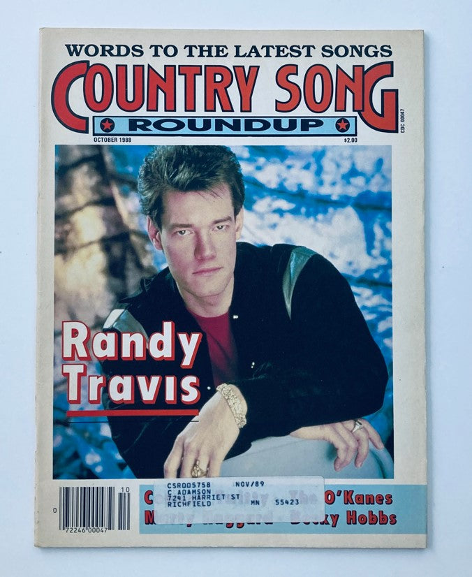 Cover of the October 1988 Country Song Roundup Magazine featuring Randy Travis. The magazine highlights Randy Travis with a striking image alongside the title, showcasing elements of 1980s country music culture.