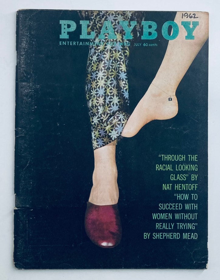 Vintage Playboy Magazine July 1962 cover featuring a unique design with colorful patterns and feet wearing stylish shoes, showcasing the magazine's retro aesthetic.